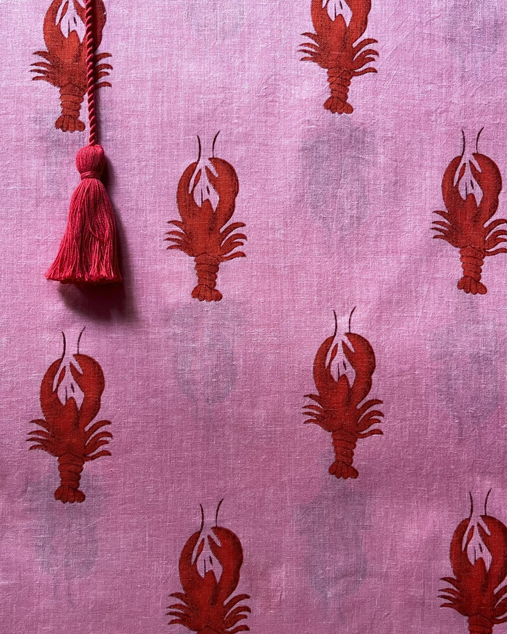 Pink fabric with red lobster pattern and tassel